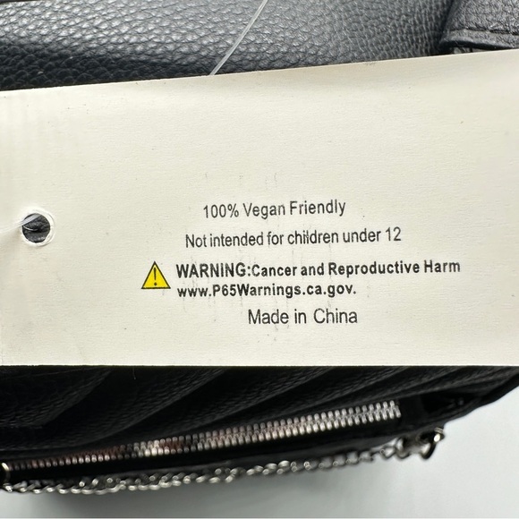 Vegan Quilted Black Backpack – Silver Chain Accent | 100% Vegan Friendly

⸻